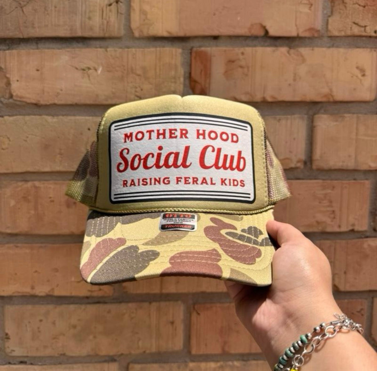 Motherhood raising feral kids trucker hat