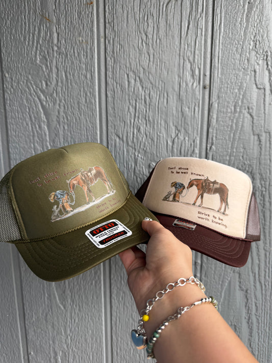 Strive to be worth knowing Trucker hat